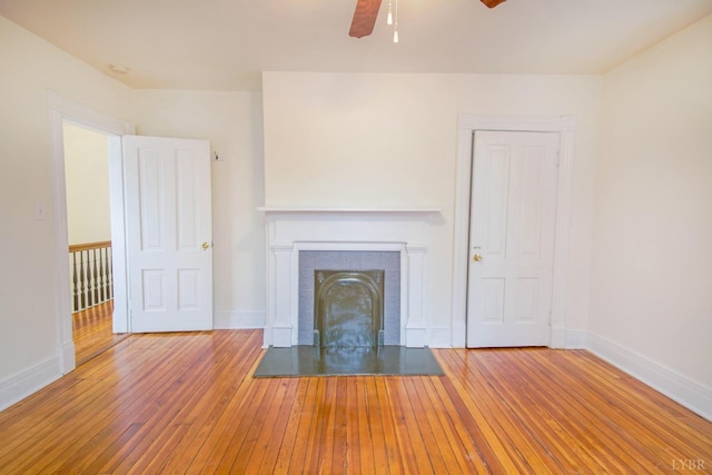226 Denver Ave, Lynchburg, VA 24503 - unfurnished living room featuring ceiling fan, wood-type flooring, baseboards, and a tile fireplace