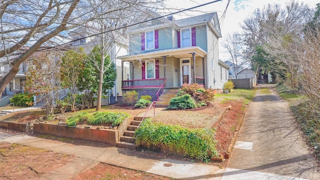 226 Denver Ave, Lynchburg, VA 24503 - view of front of house featuring stairway, fence, covered porch, and driveway
