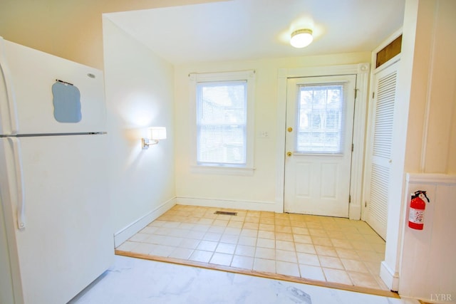 226 Denver Ave, Lynchburg, VA 24503 - doorway with baseboards, a wealth of natural light, visible vents, and light tile patterned flooring