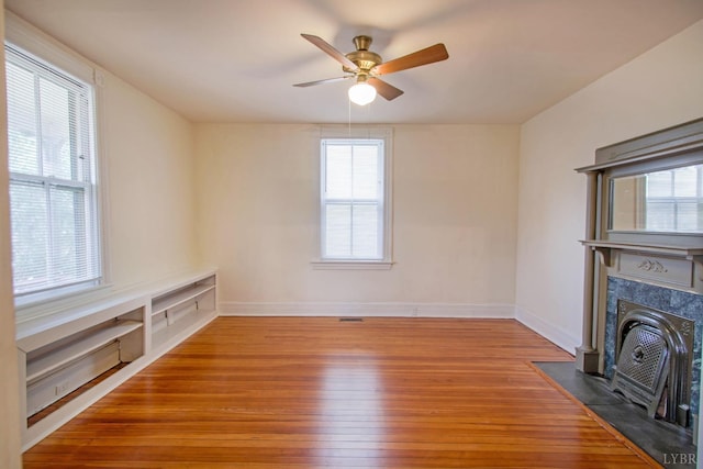 226 Denver Ave, Lynchburg, VA 24503 - unfurnished living room with ceiling fan, baseboards, and wood-type flooring