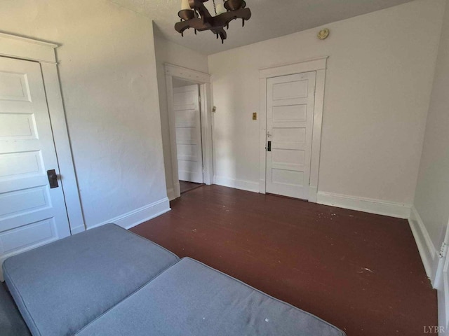 2608 Old Forest Rd, Lynchburg, VA 24501 - interior space with baseboards, a chandelier, and dark wood-type flooring
