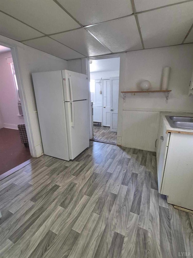 2608 Old Forest Rd, Lynchburg, VA 24501 - kitchen featuring freestanding refrigerator, open shelves, light wood-type flooring, white cabinets, and a sink