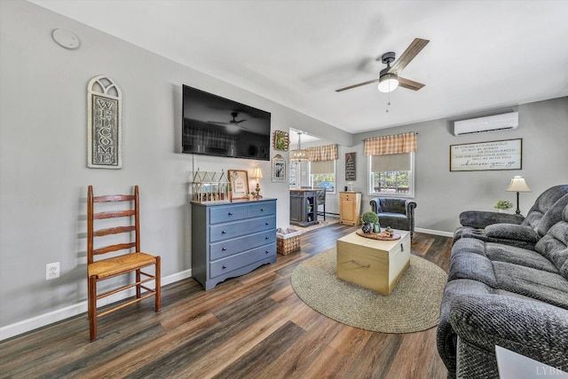 6892 Tolers Ferry Rd, Huddleston, VA 24104 - living room with an AC wall unit, baseboards, dark wood-type flooring, and ceiling fan