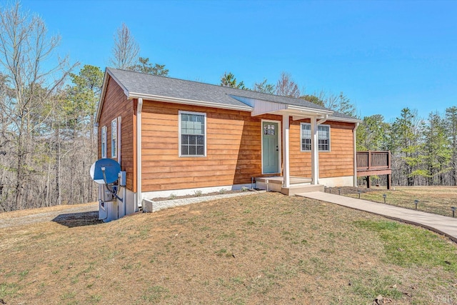 6892 Tolers Ferry Rd, Huddleston, VA 24104 - view of front of home with a shingled roof and a front lawn