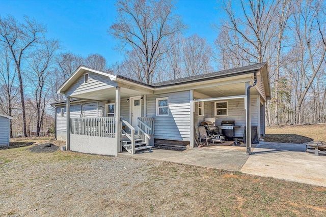 504 Spinnaker Way, Moneta, VA 24121 - view of front of house featuring covered porch, a carport, and driveway