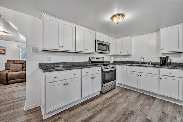 504 Spinnaker Way, Moneta, VA 24121 - kitchen with appliances with stainless steel finishes, wood finished floors, and white cabinets