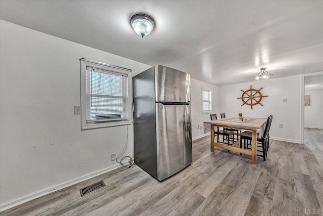 504 Spinnaker Way, Moneta, VA 24121 - kitchen with freestanding refrigerator and light wood-type flooring