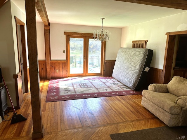506 Peters Hollow Rd, Monroe, VA 24574 - entryway with french doors, wood-type flooring, an inviting chandelier, and wainscoting