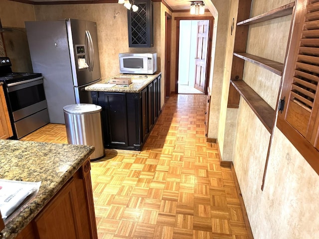 506 Peters Hollow Rd, Monroe, VA 24574 - kitchen featuring light stone counters, stainless steel appliances, and dark cabinets