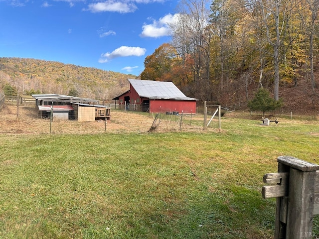 506 Peters Hollow Rd, Monroe, VA 24574 - view of yard with a mountain view, a view of trees, an outdoor structure, and fence