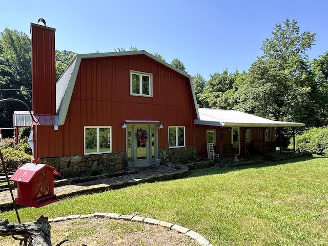 506 Peters Hollow Rd, Monroe, VA 24574 - view of front facade with a gambrel roof, a front lawn, stone siding, a barn, and a chimney