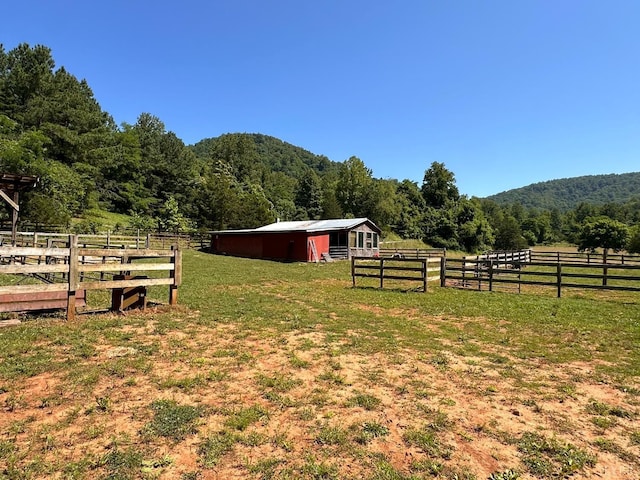 506 Peters Hollow Rd, Monroe, VA 24574 - view of yard with an outbuilding, a rural view, an exterior structure, and a wooded view