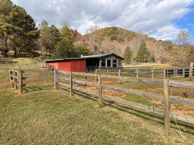 506 Peters Hollow Rd, Monroe, VA 24574 - view of yard featuring an exterior structure, a mountain view, an outbuilding, and a rural view
