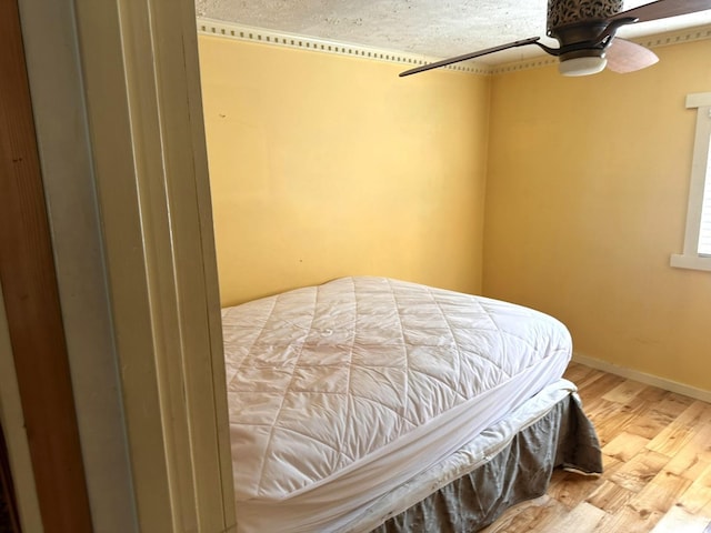 506 Peters Hollow Rd, Monroe, VA 24574 - bedroom featuring a ceiling fan, wood finished floors, and baseboards