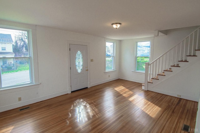 1640 Shaffer St, Lynchburg, VA 24501 - entrance foyer featuring visible vents, stairs, baseboards, and wood finished floors