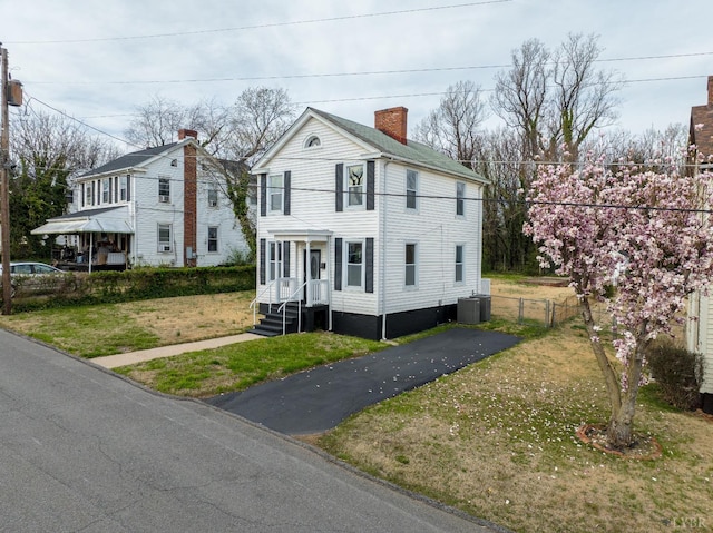 1640 Shaffer St, Lynchburg, VA 24501 - view of front facade with a front yard, central AC, driveway, and fence
