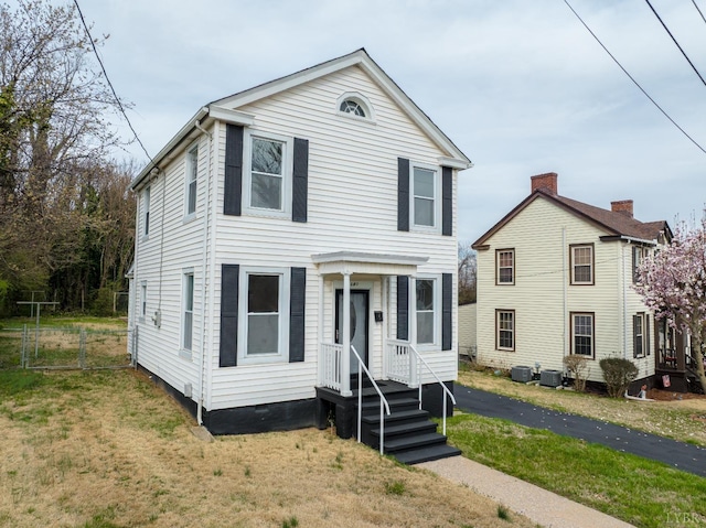 1640 Shaffer St, Lynchburg, VA 24501 - view of front of home with crawl space, central AC unit, a front yard, and fence
