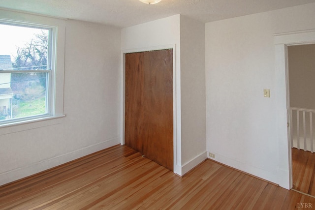 1640 Shaffer St, Lynchburg, VA 24501 - unfurnished bedroom featuring light wood-type flooring, baseboards, and a closet