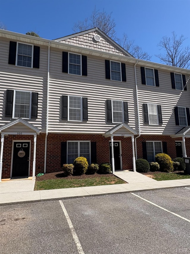 2009 Lakeside Dr Unit 302, Lynchburg, VA 24502 - view of property featuring uncovered parking and brick siding