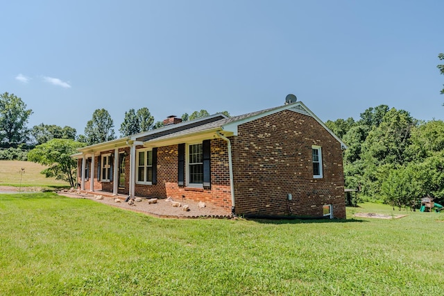 1553 Old Stage Rd, Amherst, VA 24521 - view of property exterior with a yard, a chimney, and brick siding