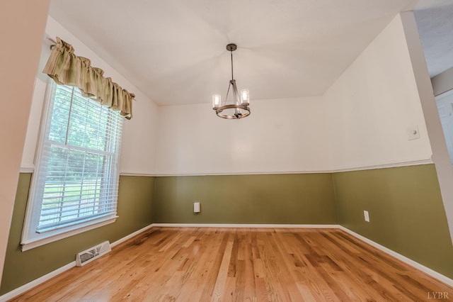 1553 Old Stage Rd, Amherst, VA 24521 - spare room with a chandelier and wood finished floors