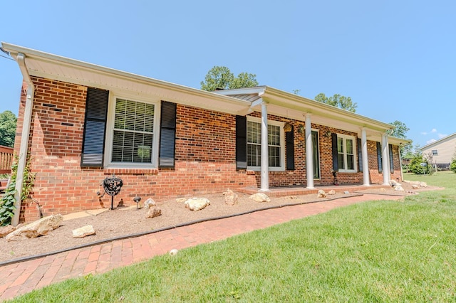 1553 Old Stage Rd, Amherst, VA 24521 - single story home featuring a front yard, brick siding, and covered porch