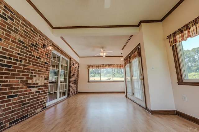1553 Old Stage Rd, Amherst, VA 24521 - empty room with ceiling fan, light wood-type flooring, plenty of natural light, brick wall, and crown molding