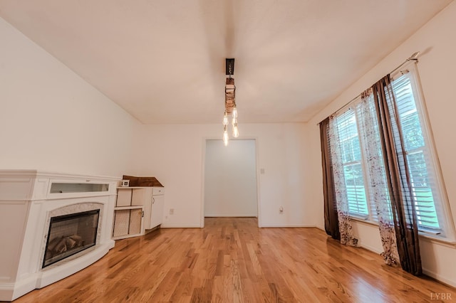 1553 Old Stage Rd, Amherst, VA 24521 - unfurnished living room with light wood-type flooring and a premium fireplace