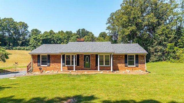 1553 Old Stage Rd, Amherst, VA 24521 - ranch-style home featuring a front yard, a chimney, brick siding, and a shingled roof