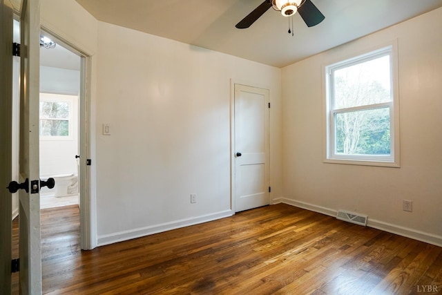 206 Caroline Ave, Brookneal, VA 24528 - unfurnished room with wood finished floors, ceiling fan, and baseboards