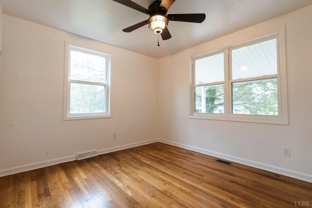 206 Caroline Ave, Brookneal, VA 24528 - unfurnished room featuring healthy amount of natural light, wood-type flooring, baseboards, and ceiling fan
