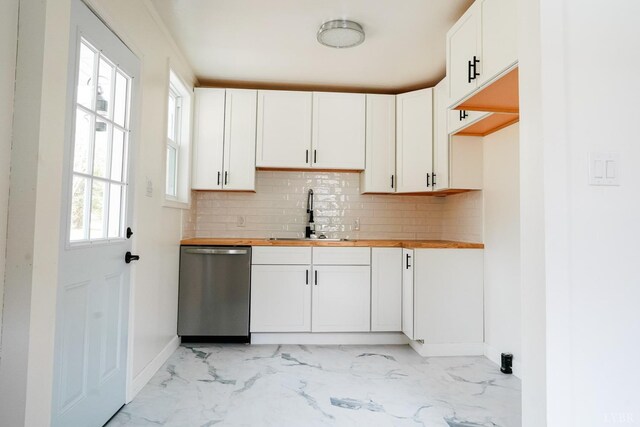 206 Caroline Ave, Brookneal, VA 24528 - kitchen featuring stainless steel dishwasher, a sink, wooden counters, light marble finish flooring, and baseboards