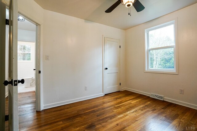 206 Caroline Ave, Brookneal, VA 24528 - unfurnished room with wood finished floors, ceiling fan, and baseboards
