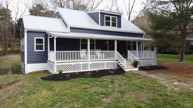206 Caroline Ave, Brookneal, VA 24528 - view of front of house with a porch, a front lawn, and metal roof