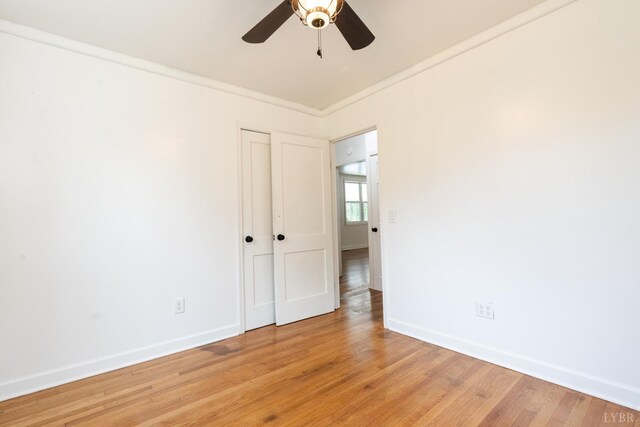 206 Caroline Ave, Brookneal, VA 24528 - spare room featuring baseboards, ceiling fan, light wood-type flooring, and crown molding