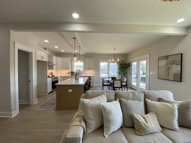 1267 Harborough Dr, Forest, VA 24551 - living room with wood finished floors, baseboards, recessed lighting, a chandelier, and french doors
