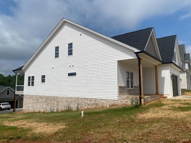 1267 Harborough Dr, Forest, VA 24551 - view of side of home with a yard, an attached garage, and roof with shingles