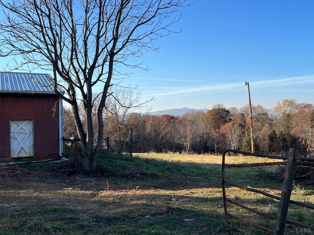 1358 S Coolwell Rd, Madison Heights, VA 24572 - view of yard with a storage shed, an outbuilding, fence, and a forest view