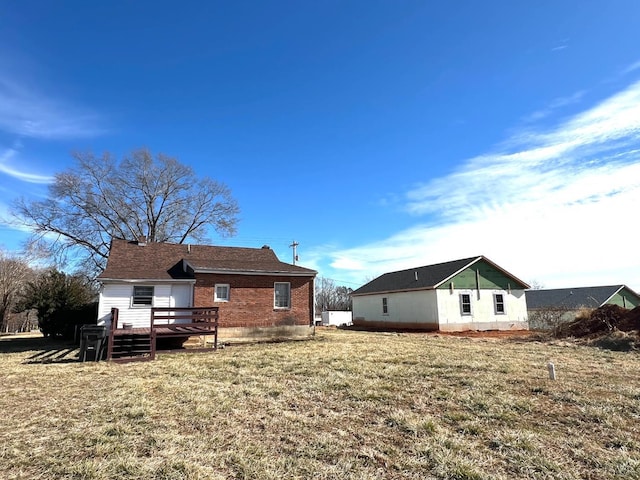 1358 S Coolwell Rd, Madison Heights, VA 24572 - rear view of house featuring a deck, a lawn, and brick siding