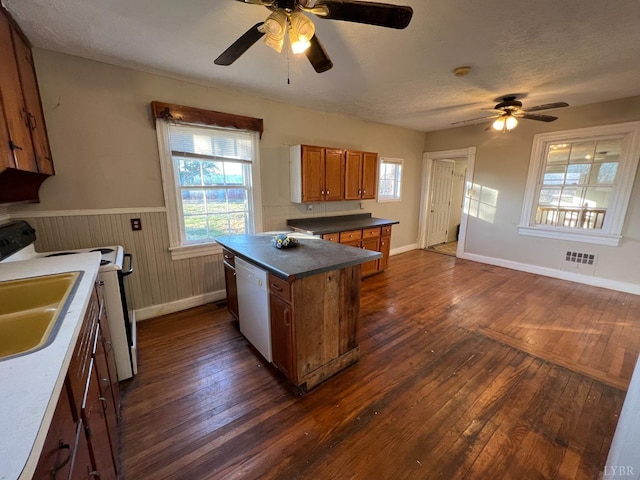 1358 S Coolwell Rd, Madison Heights, VA 24572 - kitchen featuring white appliances, a healthy amount of sunlight, a ceiling fan, visible vents, and brown cabinets
