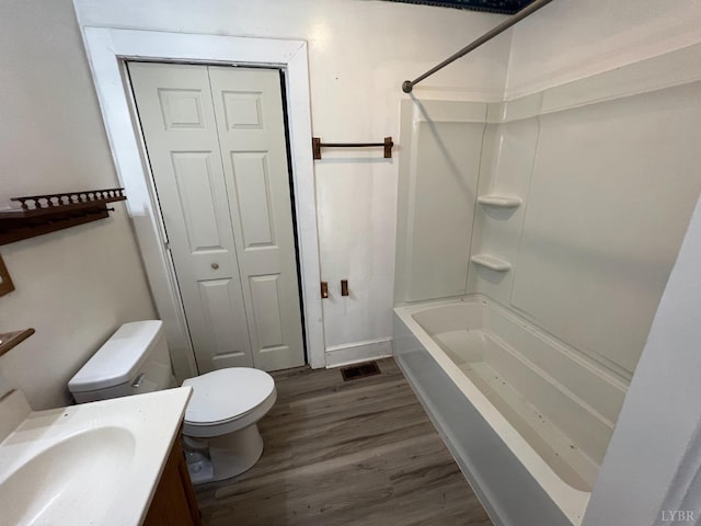1358 S Coolwell Rd, Madison Heights, VA 24572 - full bathroom with visible vents, toilet, wood finished floors, a closet, and vanity