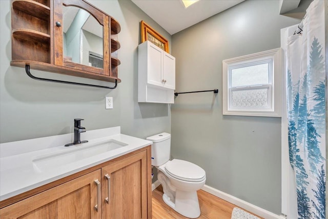 3554 Leffel Rd, Roanoke, VA 24018 - bathroom featuring wood finished floors, toilet, vanity, baseboards, and curtained shower