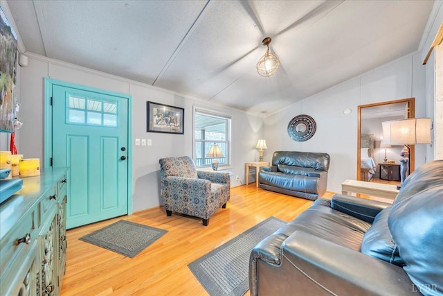 3554 Leffel Rd, Roanoke, VA 24018 - living room with vaulted ceiling, wood finished floors, and ornamental molding