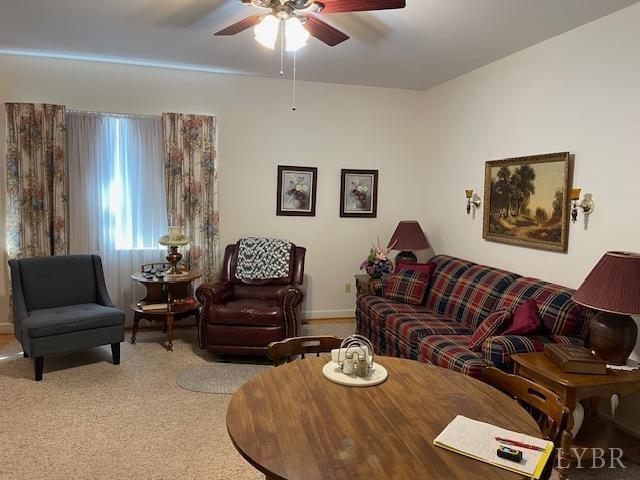 1534 Main St, Altavista, VA 24517 - living room with carpet floors, baseboards, and ceiling fan