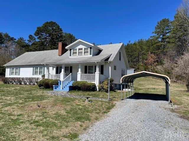 1534 Main St, Altavista, VA 24517 - view of front of house featuring a carport, covered porch, a chimney, a front lawn, and driveway