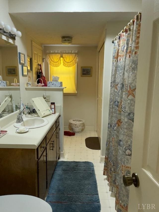 1534 Main St, Altavista, VA 24517 - bathroom featuring toilet, vanity, baseboards, and a shower with curtain