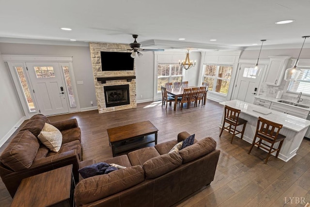 1055 Tori Ct, Forest, VA 24551 - living area with a fireplace, ceiling fan, healthy amount of natural light, dark wood finished floors, and recessed lighting