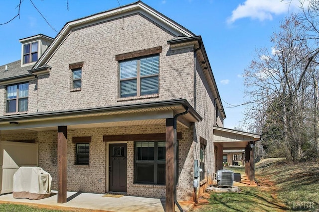 1055 Tori Ct, Forest, VA 24551 - back of house with brick siding, central AC unit, and a porch