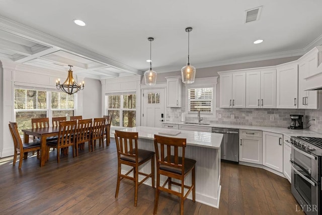 1055 Tori Ct, Forest, VA 24551 - kitchen featuring stainless steel appliances, a sink, tasteful backsplash, white cabinets, and beam ceiling