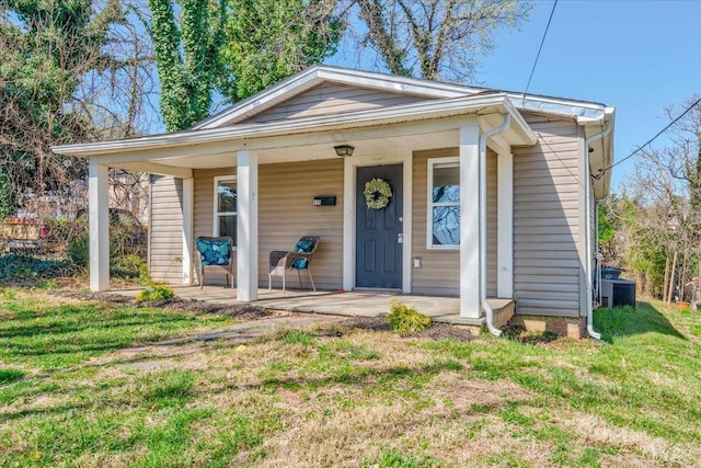 111 Willow St, Lynchburg, VA 24503 - bungalow featuring a porch, central AC unit, and a front yard